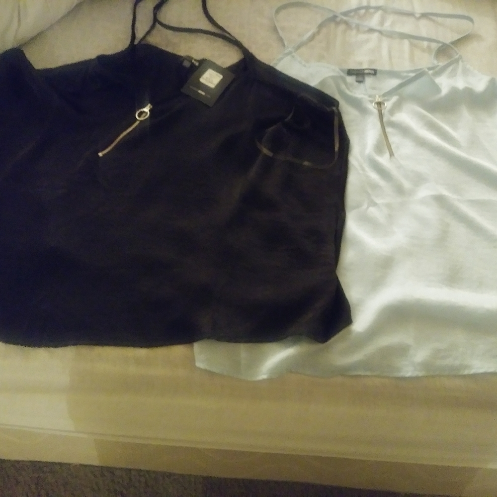 Two silk material sleeves tanks